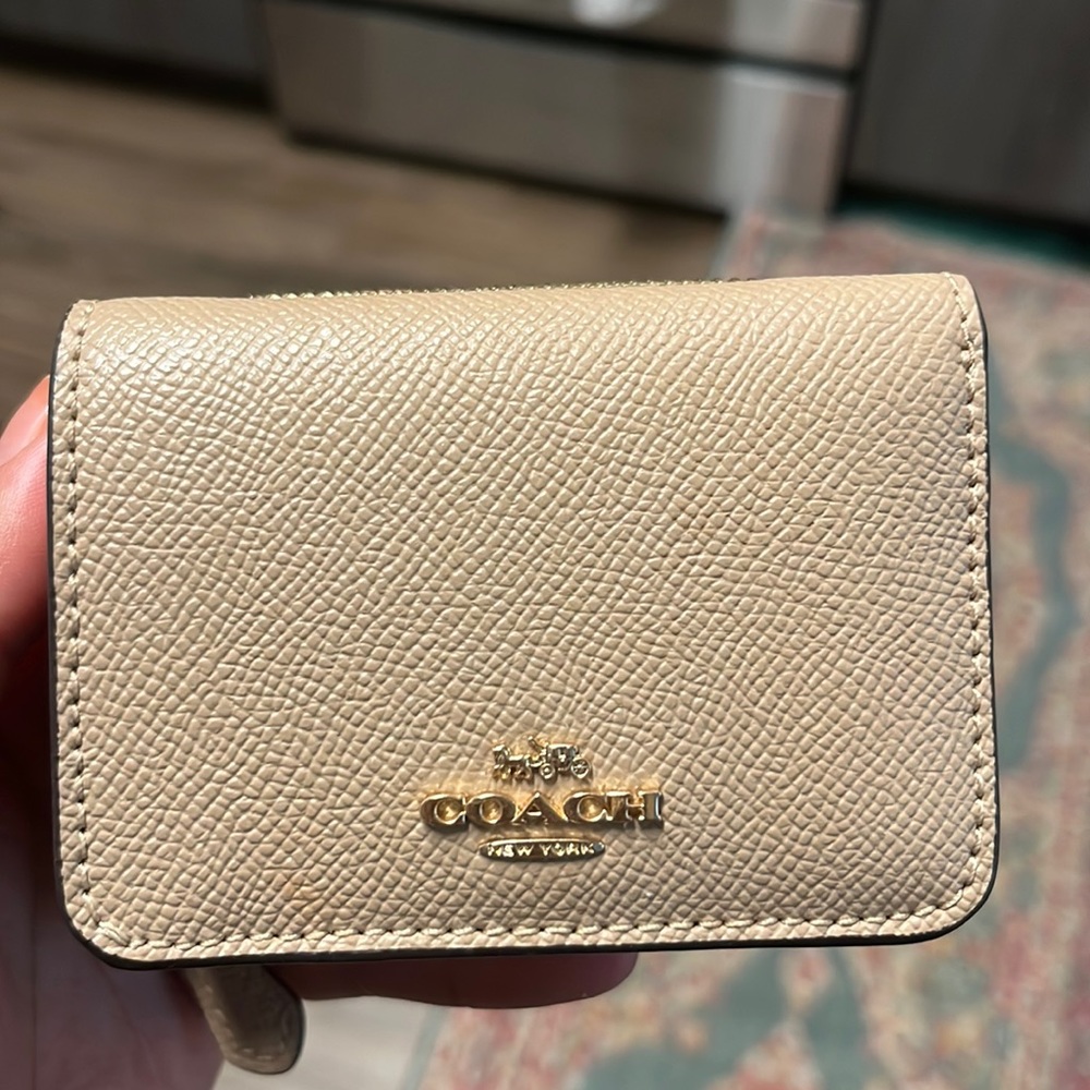 Coach beige tri-fold wallet